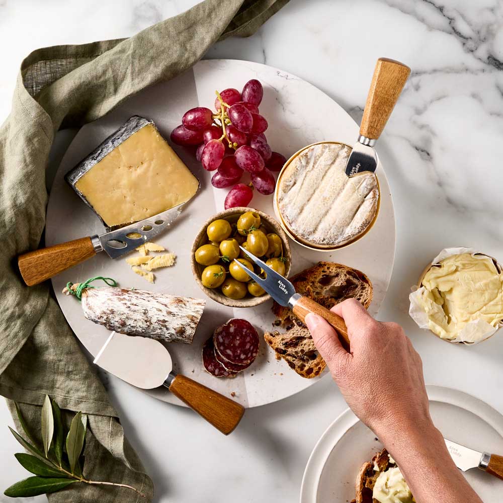 5 Acacia Wood Cheese Knives on marble board with charcuterie - Robins Kitchen