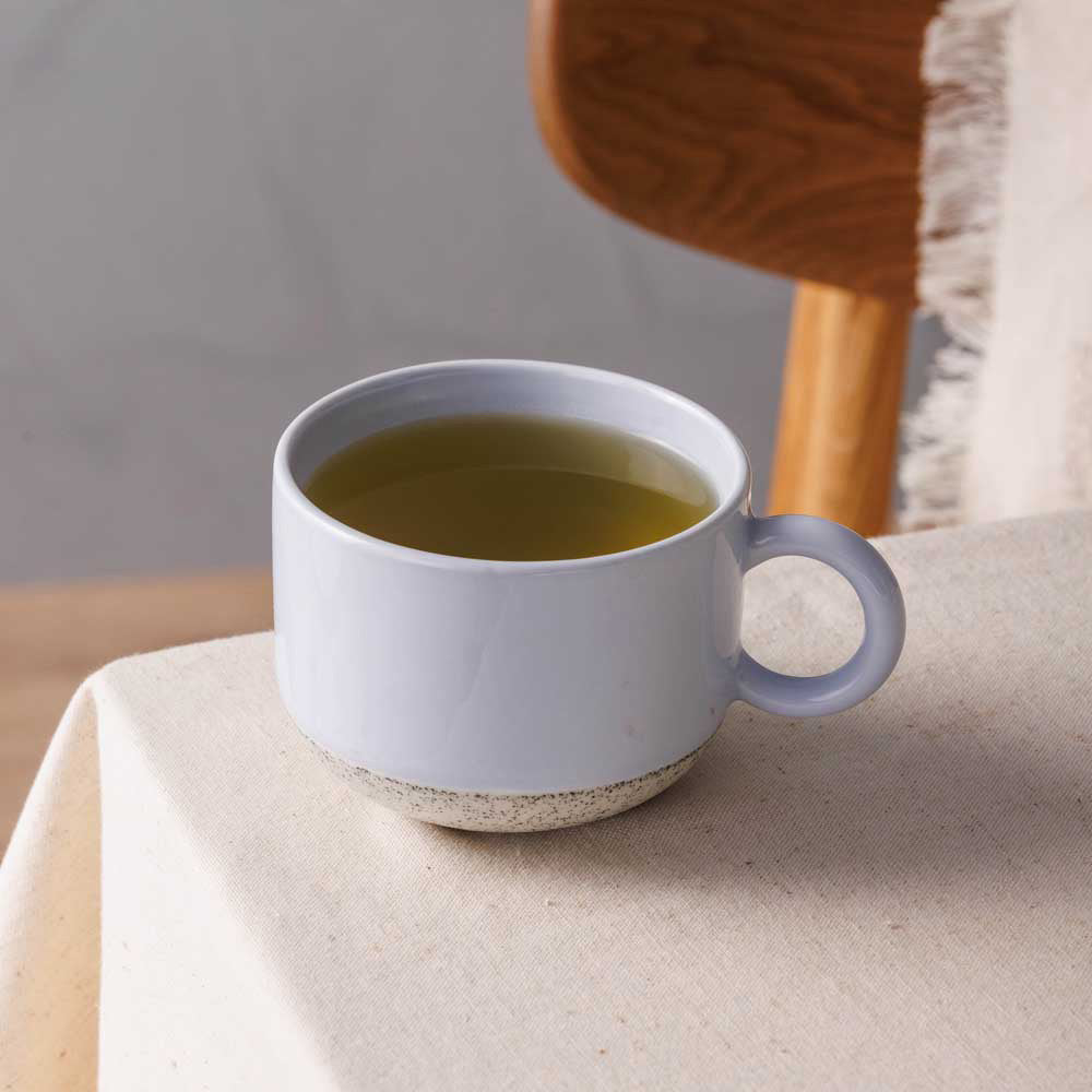 Ecology Hull Stoneware Mug 340ml in Blue sitting on kitchen table at Robins Kitchen