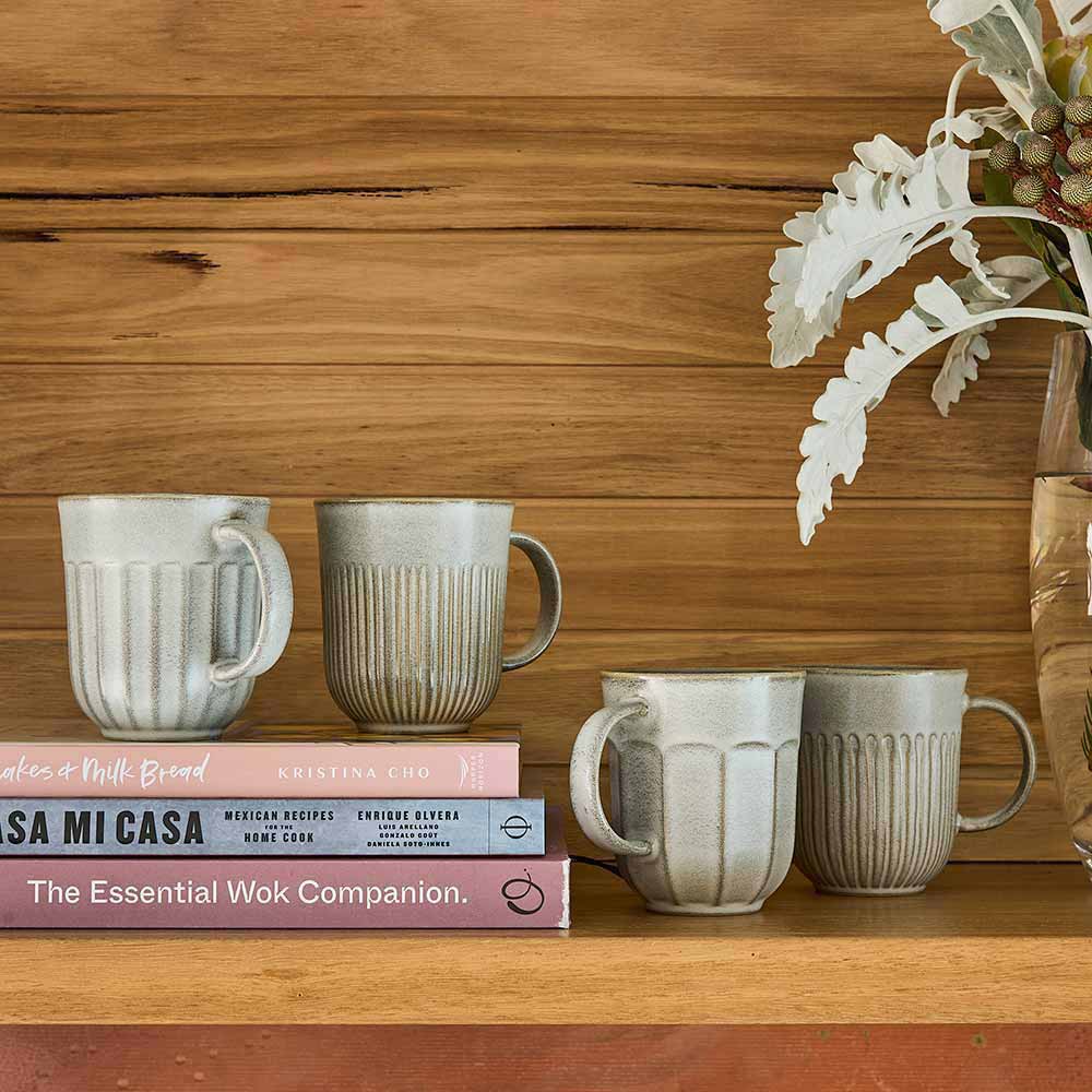 Ecology Chapel Set of 4 Mugs 330ml Blue sitting on a stack of books at Robins Kitchen