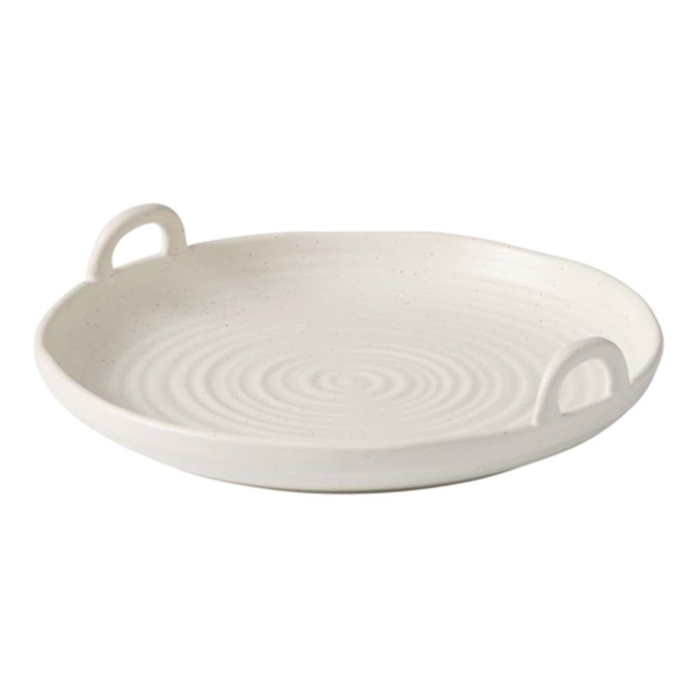 Stoneware shallow serving bowl that has side handles for easy carrying and serving, with a textured finish.