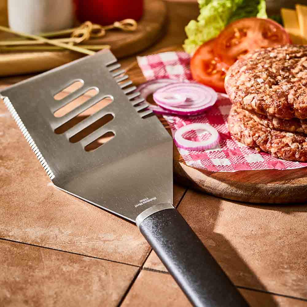 stainless steel BBQ turner next to burger patties - Robins Kitchen