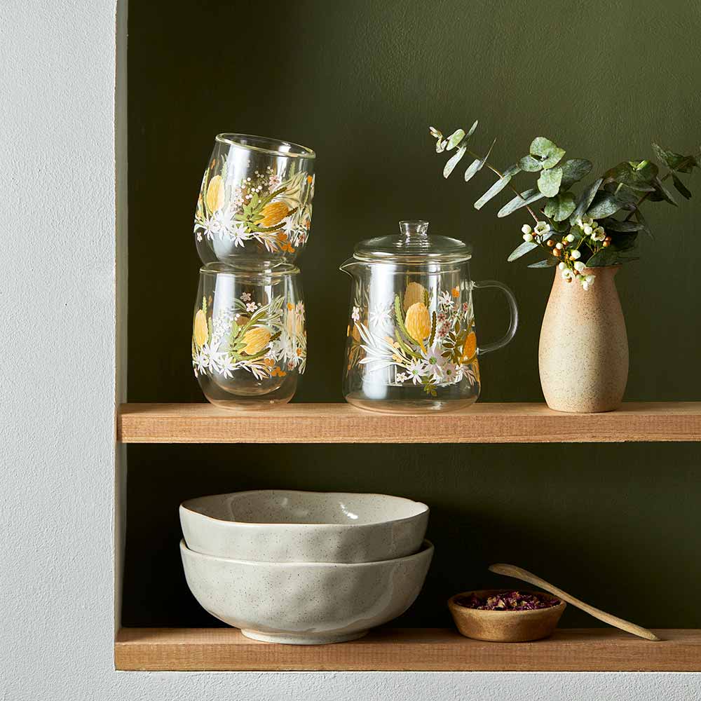 Glass teapot and glass cups with Australian flora prints