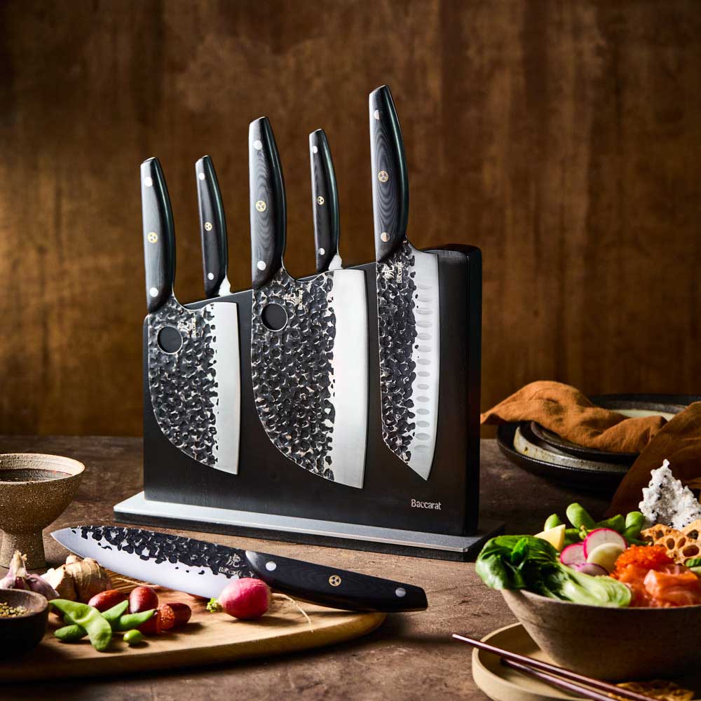 Baccarat KUROI KIBA 7 Piece Knife Block on wooden bench with vegetables at Robins Kitchen