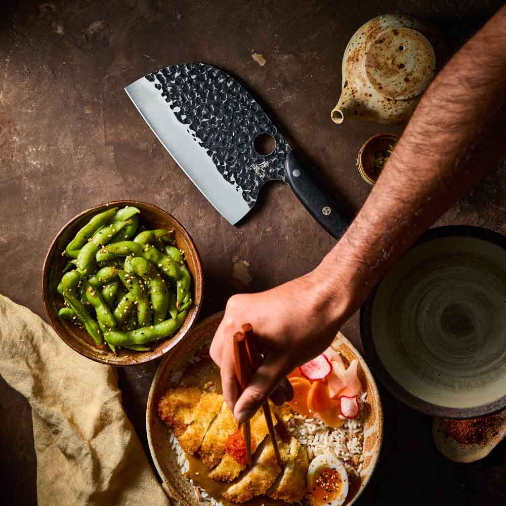 Man eating katsu chicken - Baccarat KUROI KIBA Moon Knife 17.5cm at Robins Kitchen