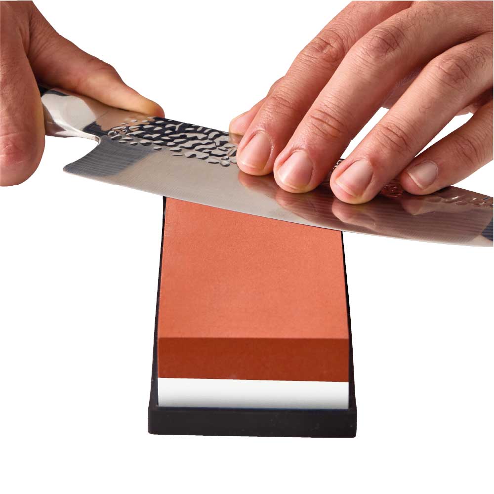 Man sharpening knife with Whetstone 600/2000 - Robins Kitchen